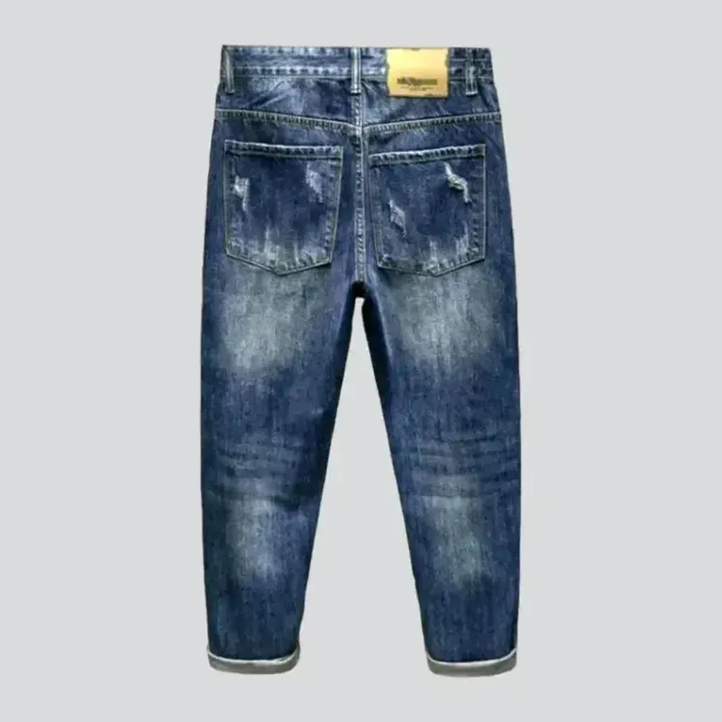 Distressed sanded jeans for men